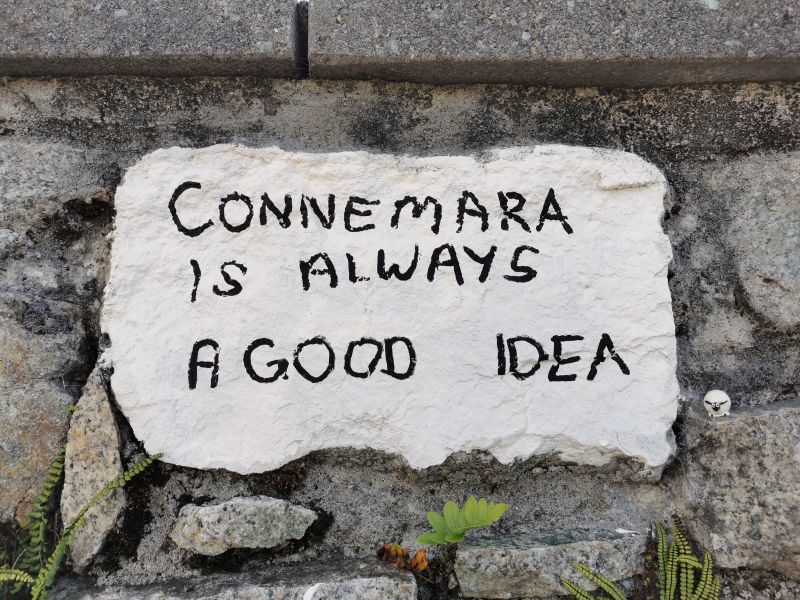 A message on a stone in the wall at the cafe in Roundstone