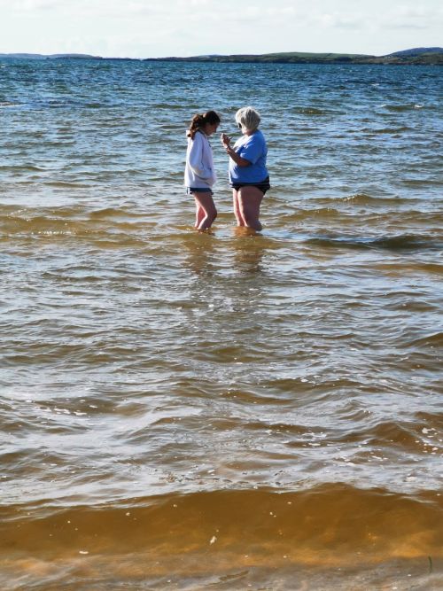 Dionee and Matilda in the water at Mannin Bay Blueway