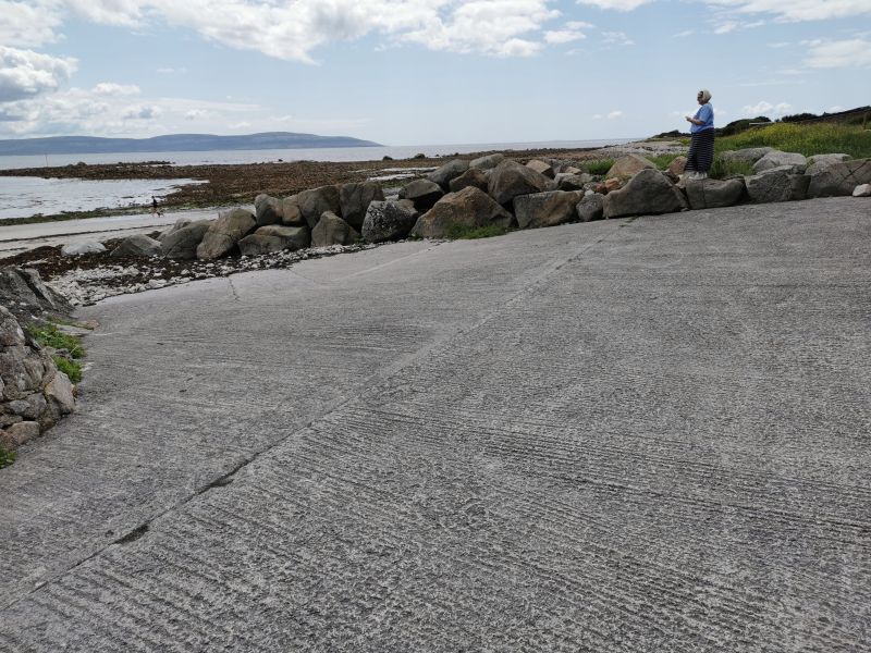 Dionee enjoying a break from driving and the view over Galway Bay at Bearna Harbour