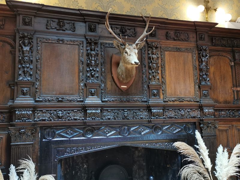 Intricate carvings on the mantle piece above the fireplace Kylemore Abbey