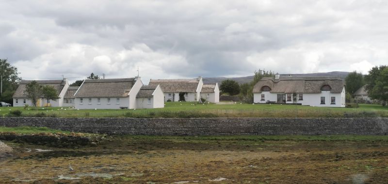 Thatched houses and whitewashed buildings near the head of Galway Bay