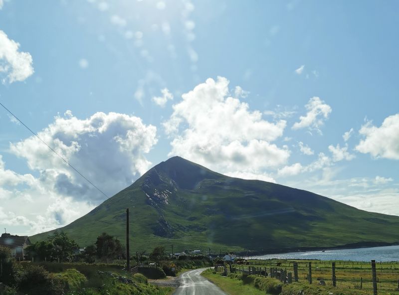 The narrow road into Dugort and Slievemore at centre stage