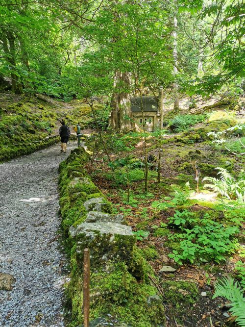 The walkway to the mausoleum coming of the main trail to the church at Kylemore Abbey