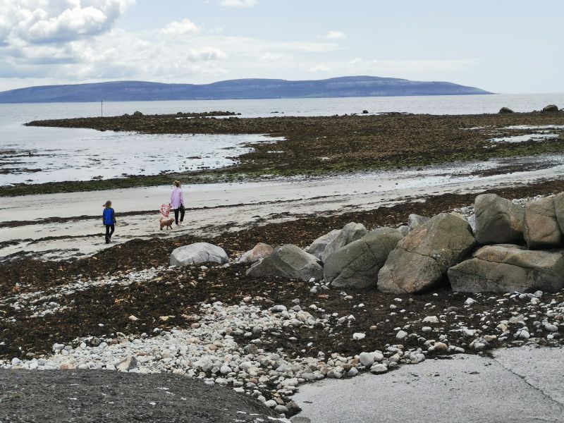 Walking on the beach near Bearna Harbour