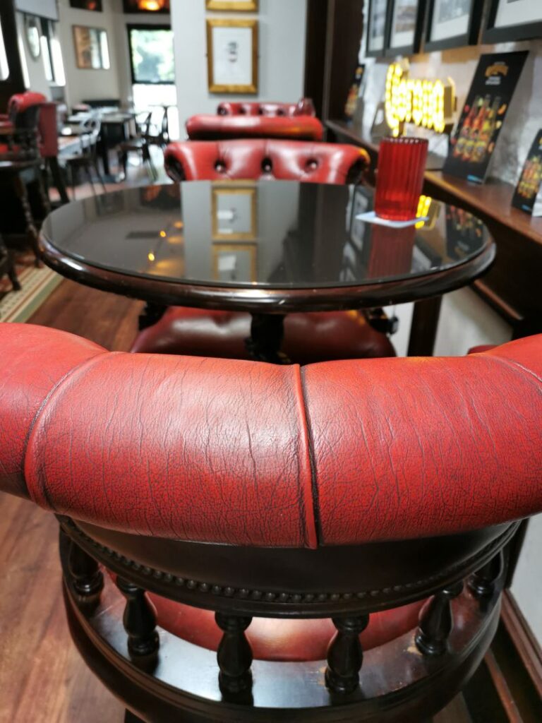 A table and chairs in the pub in Ballina